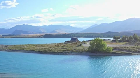 Stone Church on Lake edge drone shot on a sunny day Stock Footage 159563243