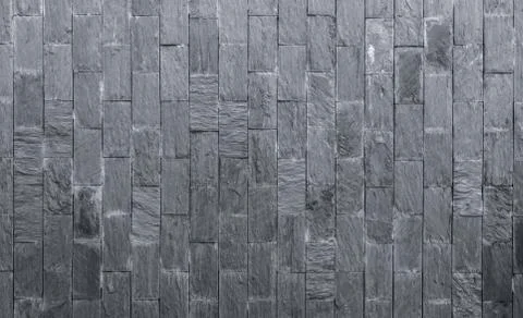 Stone cladding texture background. Gray stone wall. Stone brick for home exte 库存照片