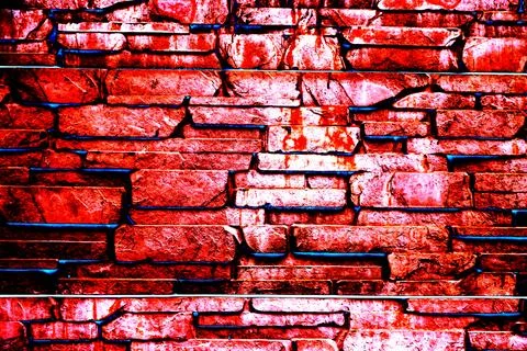 Stone cladding wall made of striped stacked slabs of natural brown rocks. P.. Stock Photos