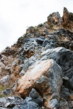 Stone on cliff Stock Photos
