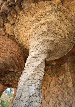 Stone column with abstract spiral shape inside Park Güell Barcelona Foto stock