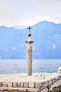 The stone column with the iron cross Stock Photos