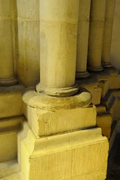 Stone column in yellow light, Nevers Cathedral (Cathdrale Saint-Cyr-et-Sainte Stock Photos
