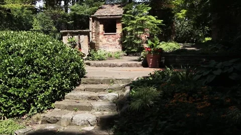 Stone concrete cement steps with small villa home house shed at top surrounded Stock Footage 249422287