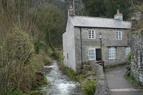 Stone Cottage And Stream In Castleton, The Peak District, England. Stock Photos