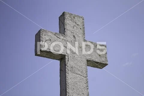 Stone cross in cemetery, christianity and catholic Stock Photos