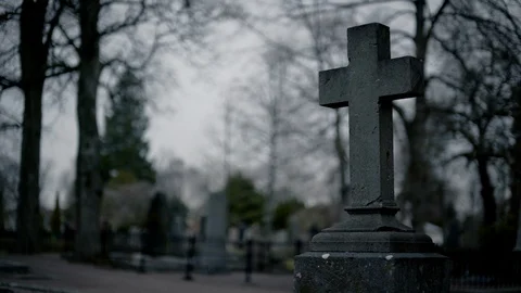 Stone Cross in a Cemetery Rack Focus Video stock 88908583
