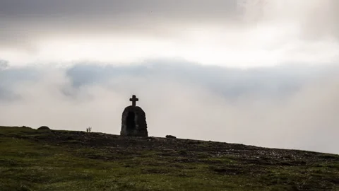 Stone cross on mountain in moving clouds timelapse Stock Footage 292306233