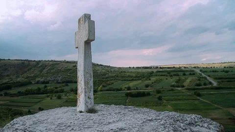 Stone cross under blue sky, Moldova, Orheiul Vechi Video stock 88384042
