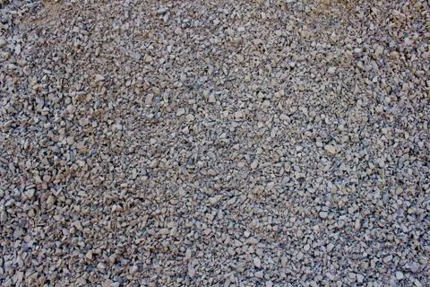 Stone crumb as creative textured background for your design. Granite gravel b Stock Photos