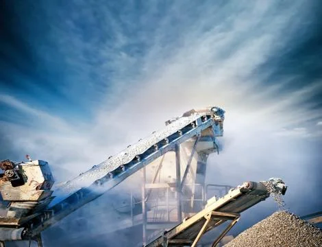 Stone crusher conveyor on mining extraction plant Stock Photos