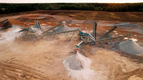 Stone crusher machine and hills of rocks, sand and gravel production. Mining Stock Footage 167353341