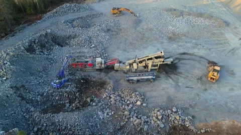 Stone crushing plant processing rocks in Finland during spring Stock Footage 339635531