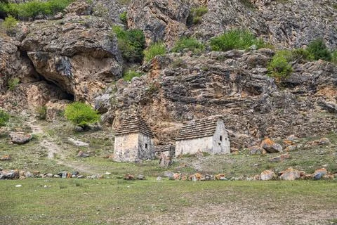 Stone crypts for the burial of the dead in a high-mountain village of North O Fotos de archivo