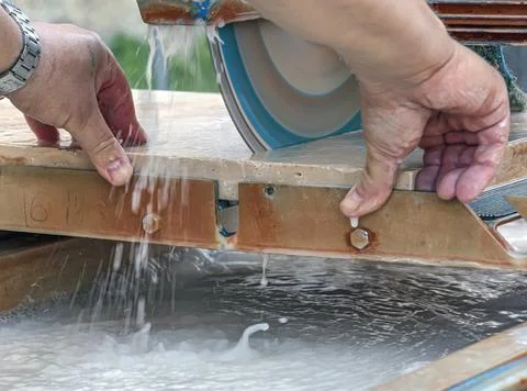 Stone Cutting Process with Water-Cooled Circular Blade Stock Photos
