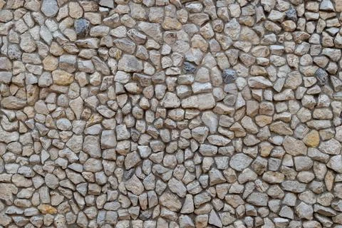 Stone decorated mosaic wall flat seamless texture and full frame background.. Stock Photos