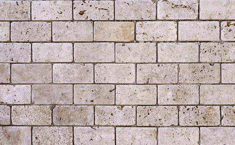 Stone decorative masonry wall background. Bricks made of natural stone surface Stock Photos