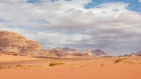Stone desert landscape, clouds and shadows move fast Stock Footage 109084801