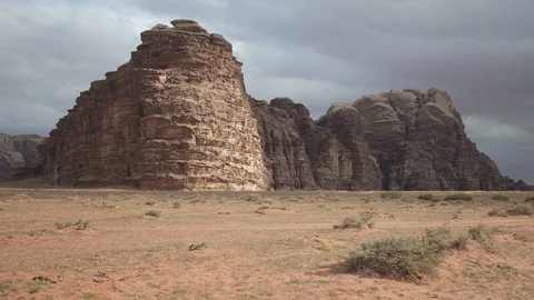 Stone desert landscape. Red rocks and sand. Cloudy sky. Stock Footage 112759872