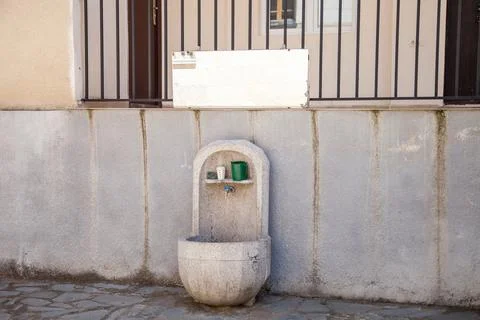 Stone drinking fountain on the streets Stock Photos