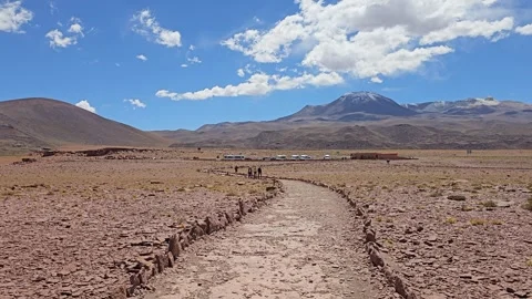 Stone-Edged Trail with Snowy Volcano and Clouds, Piedras Rojas, Atacama, Chile Video stock 331541133