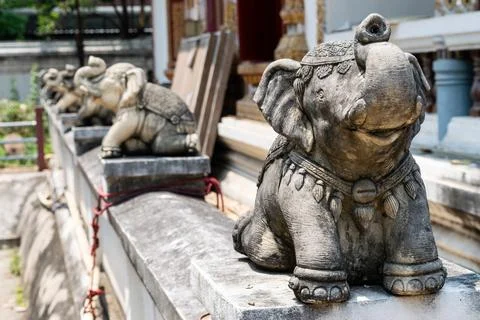 Stone elephant statues guarding buddhist temple in bangkok, thailand Stock Photos