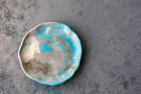 Stone emerald platter on conrete table, mockup Stock Photos