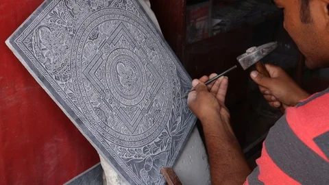 Stone Engraving Artist Enscripting Buddhist mandala Stock Footage