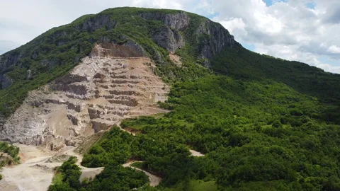 Stone extraction in quarry on the mountain. Panoramic drone view Stock Footage 133017094