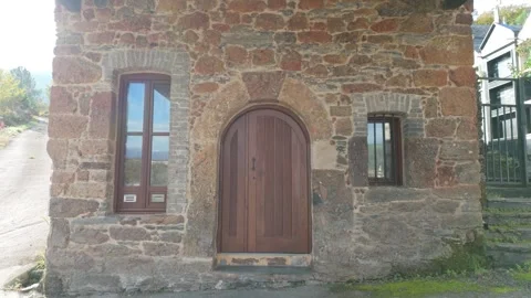 Stone Facade and Arched Doorway of Church of Penouta Stock Footage 346745880