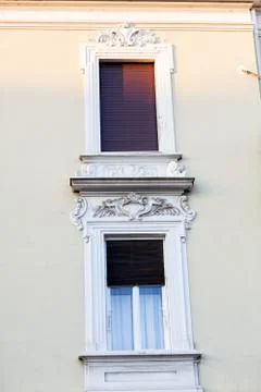 Stone facade on classical building with ornaments Stock Photos