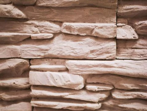 Stone facade close-up. Torn stone texture. Stone wall Foto stock