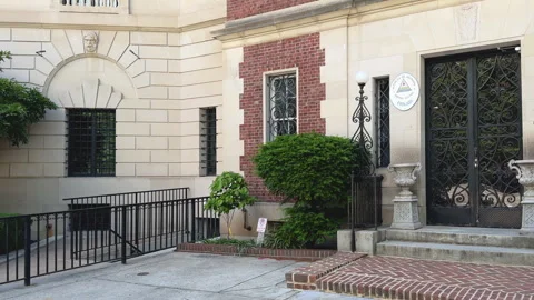 Stone facade with iron-barred windows and access ramp Stock Footage 323716694