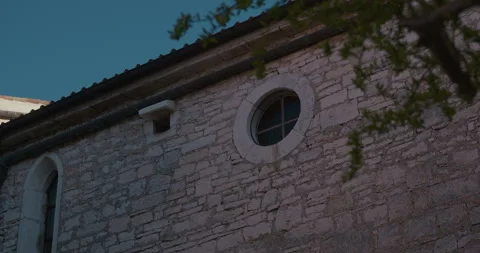 Stone facade with round window and small opening Stock-Footage 334033097