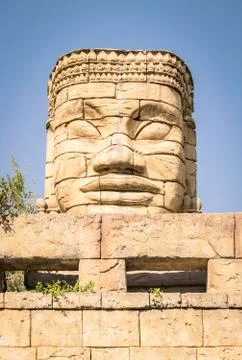 Stone face of a temple. Stock Photos
