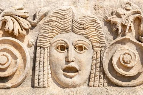 Stone faces bas relief at Myra ancient city. Demre, Turkey Stock Photos