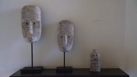 Stone faces of the statue in the interior of the room Stock Footage 275006826