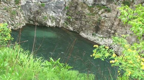 Stone falling into river at canyon Stock Footage 33635579