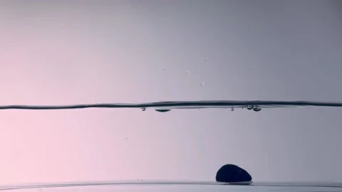 Stone falling into the water Stock Footage 143778829