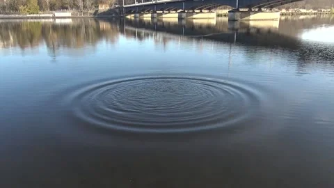 Stone Falling Into Water In Reverse Stock Footage 144328316