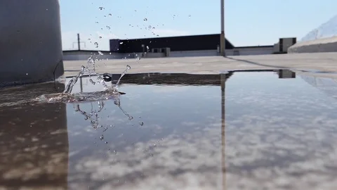 A stone falls into a puddle slow motion_(120fps) 1 20.04.2020 Stock Footage 128772135