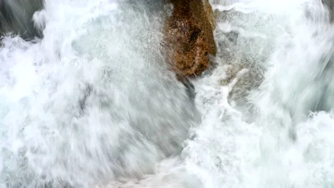 Stone in the fast reaches of the river close-up horizontally 4k Stock Footage 137171087