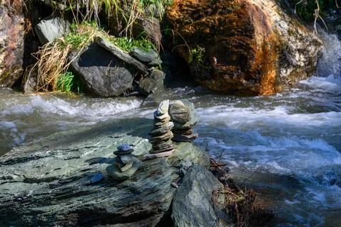Stone figures in the river Stock Photos