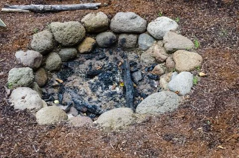 Stone firepit in the garden Stock Photos