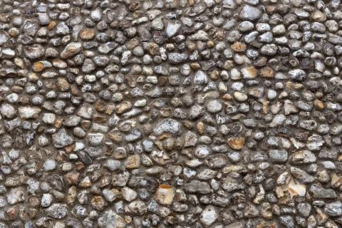 Stone flint pebble wall texture background Stock Photos