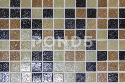 The stone floor is decorated with a variety of geometric mosaic, blue, red, w Stock Photos
