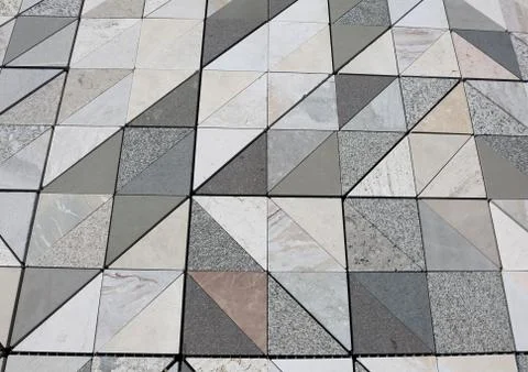 Stone floor with triangular shape each made with a different type of marble f 스톡 사진