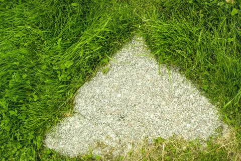 Stone footpath pattern with green grass background for interior design. Top v Stock Photos
