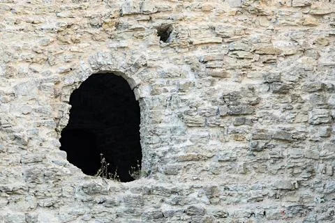 Stone fortification with a window opening Foto stock