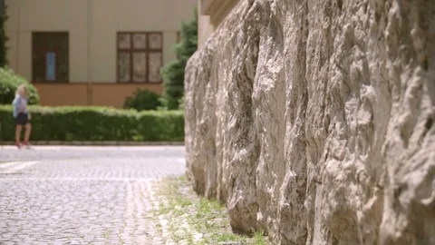 Stone Foundation of the building on the background of the sidewalk. The finished Stock Footage 109226777